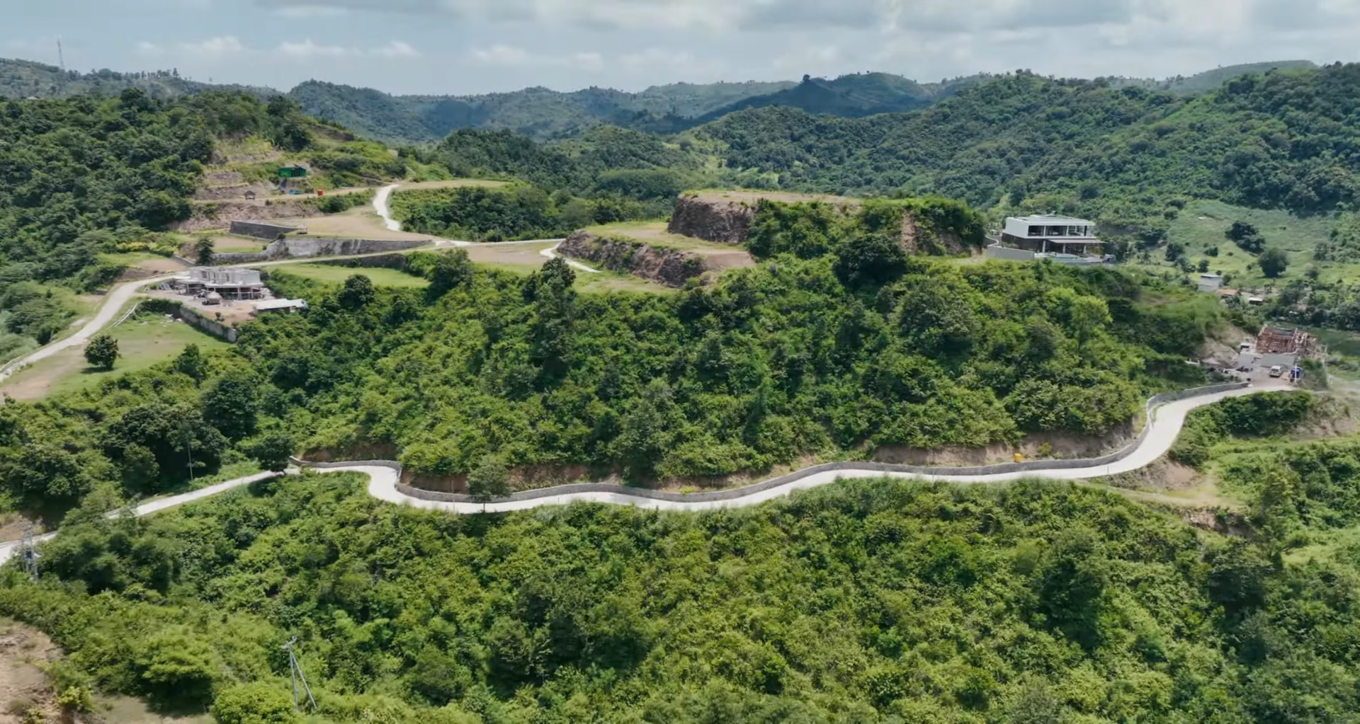 Hillside access roads and villa plots above Selong Belanak