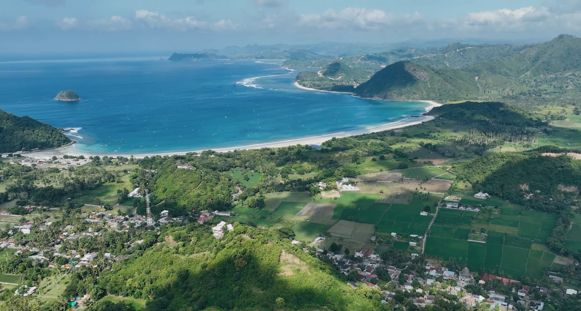 Aerial view of Selong Belanak bay with white sand beach and turquoise water